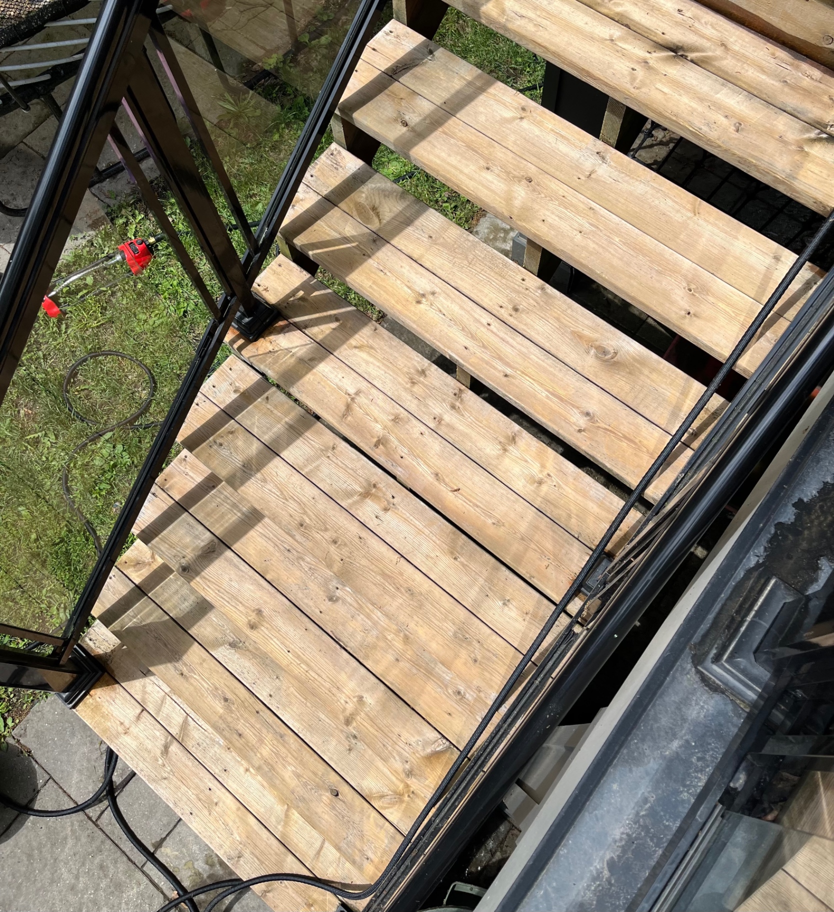 Power washing a wood deck at a home in The Beaches, Toronto